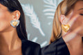 A l'Amour heart earrings in gold inside silver, and in gold