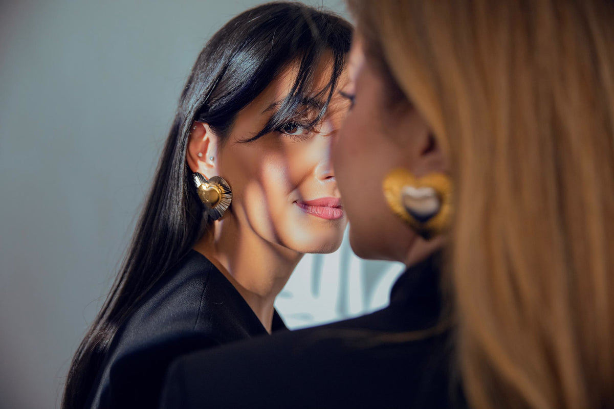 A l'Amour heart earrings in gold inside silver, and silver inside gold