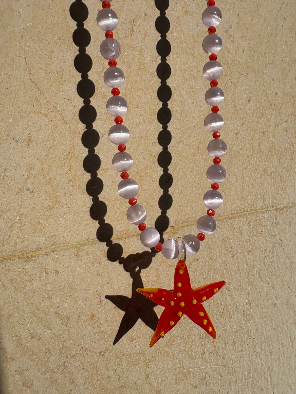 Starfish necklace with a hand-painted red glass starfish